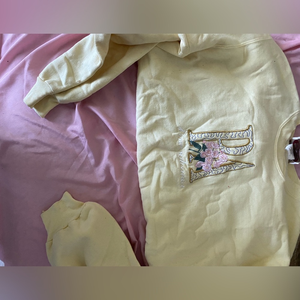 womens small yellow sweatshirt with design